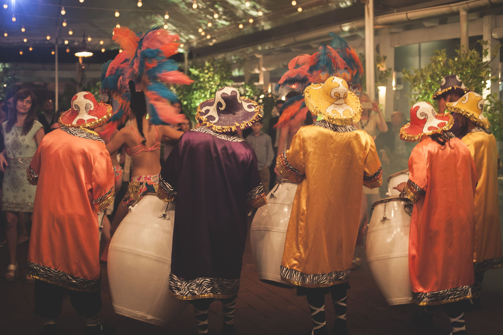 Candombe troupe with dancers performing at a corporate event