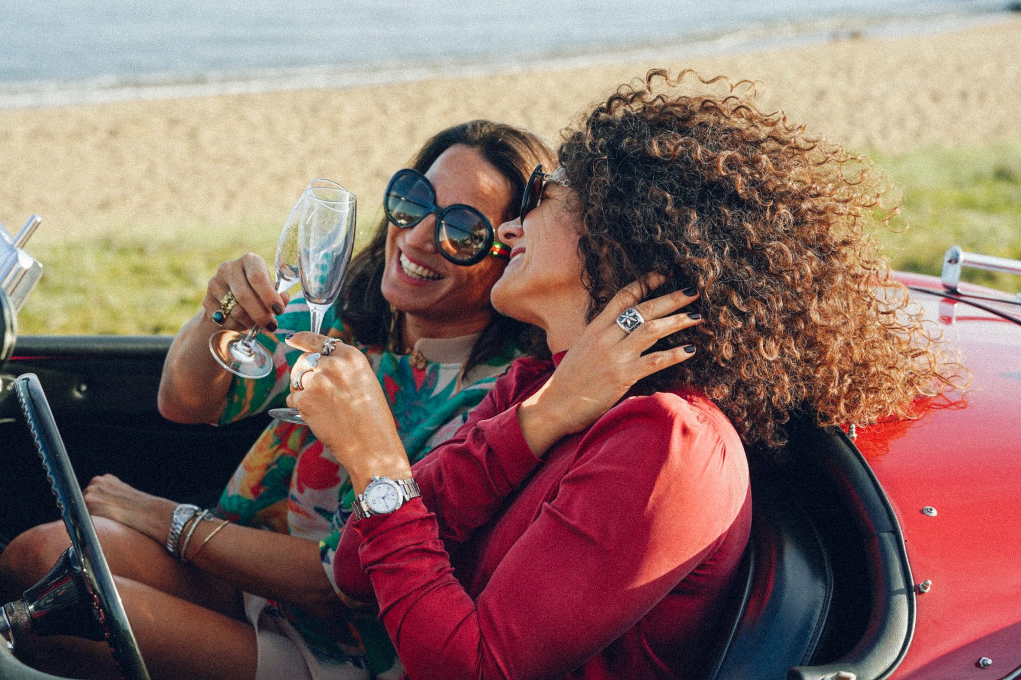 Guests toasting in a convertible