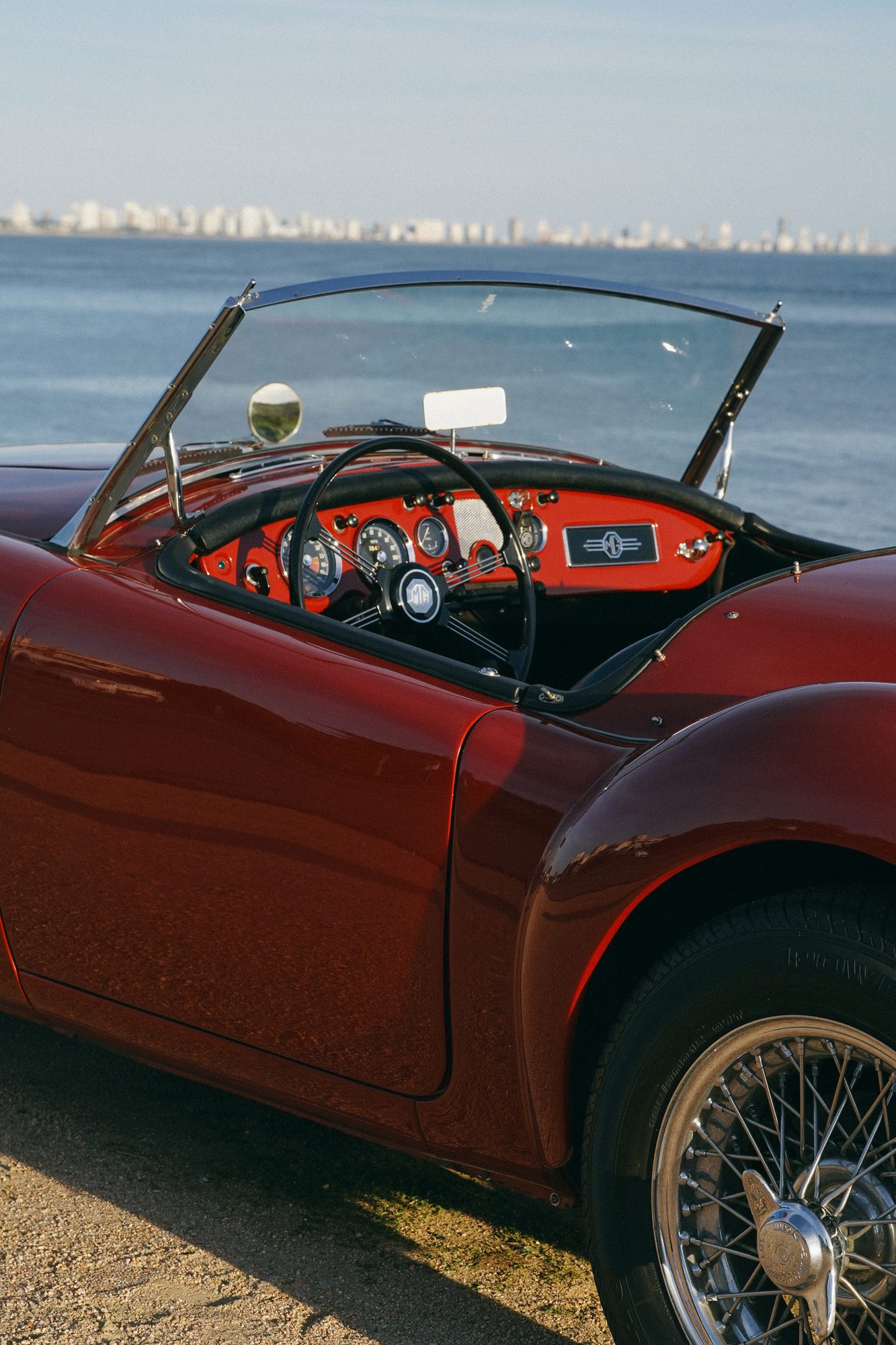 Classic roadster by the sea