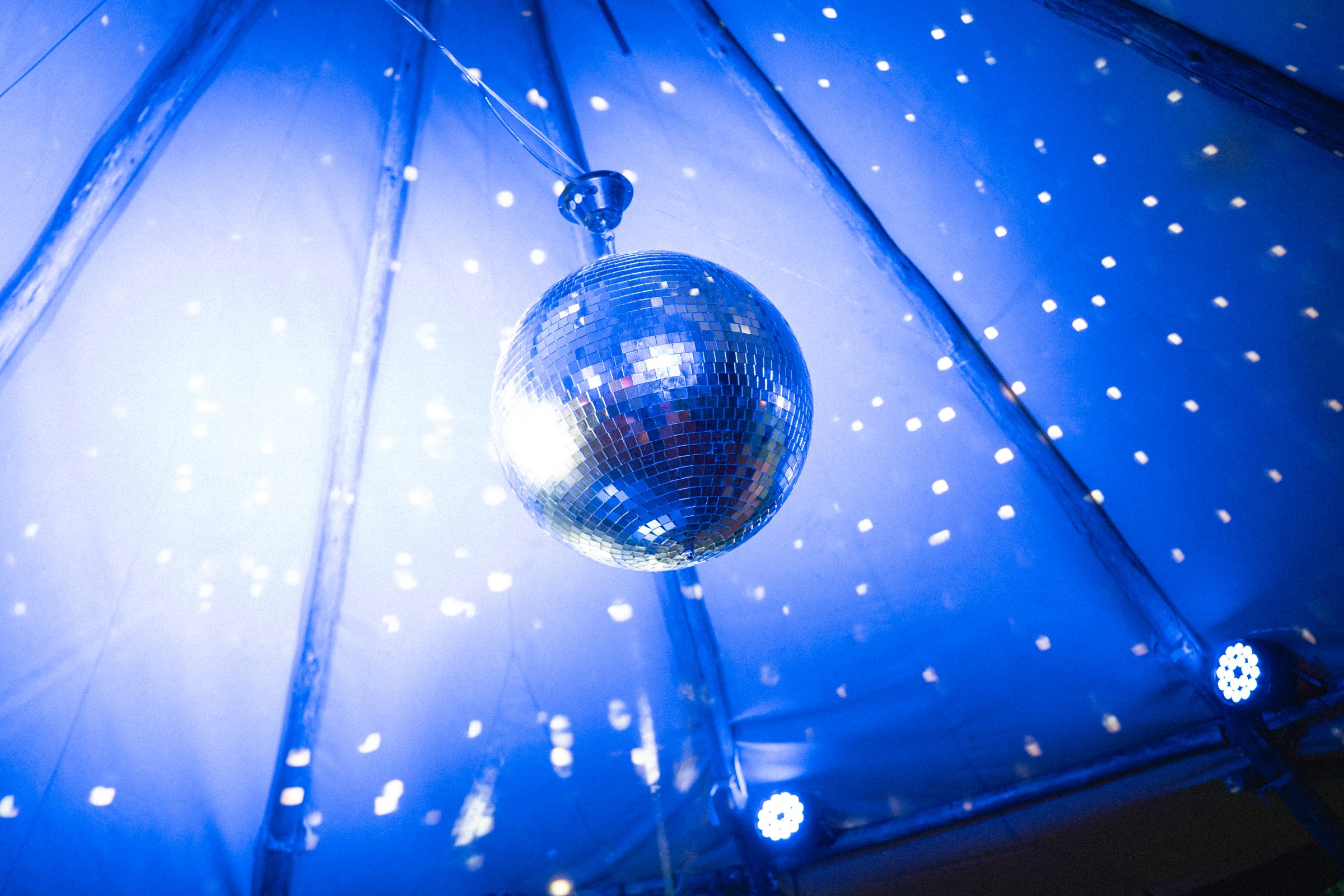 Tipi event tent lit at night