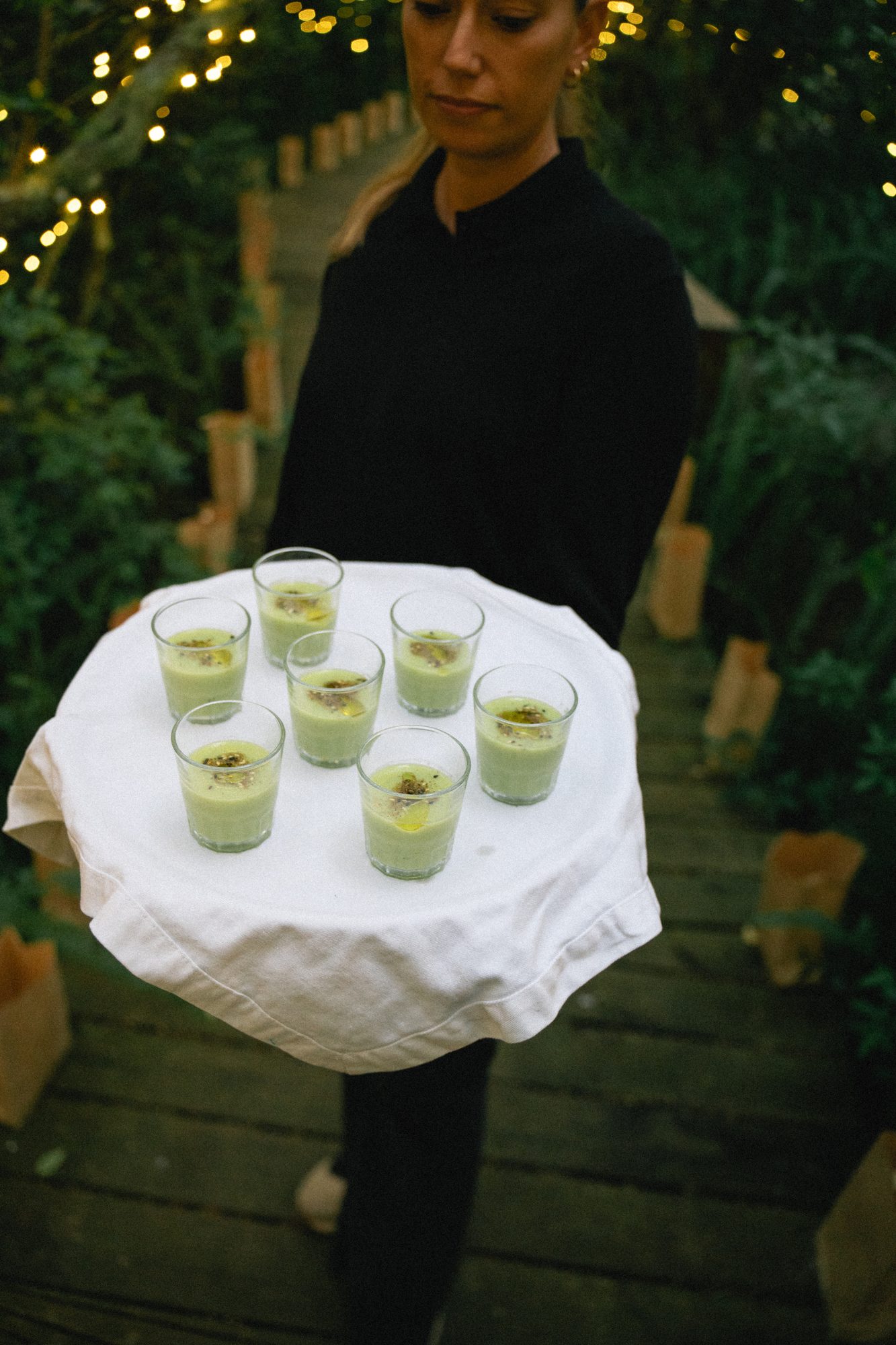 Staff serving drinks at dusk